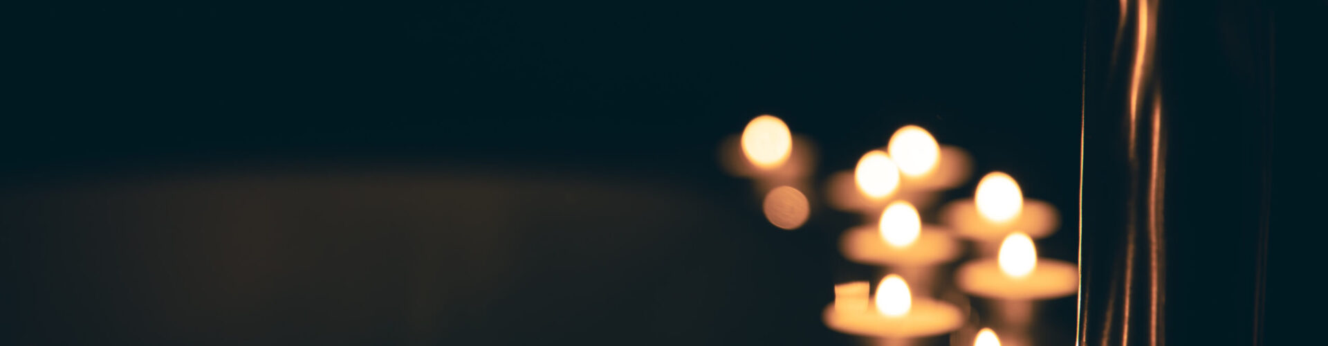 Burning candles in the bathroom in the dark, romantic atmosphere, copy space.
